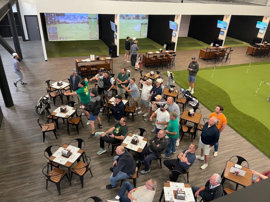 Corporate team outing on the golf simulators at Pin Point in Little River SC
